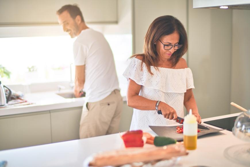 Man and Woman preparing food for meal